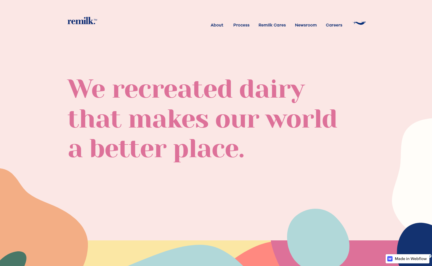 Remilk’s homepage featuring a pastel pink background and the headline “We recreated dairy that makes our world a better place.”